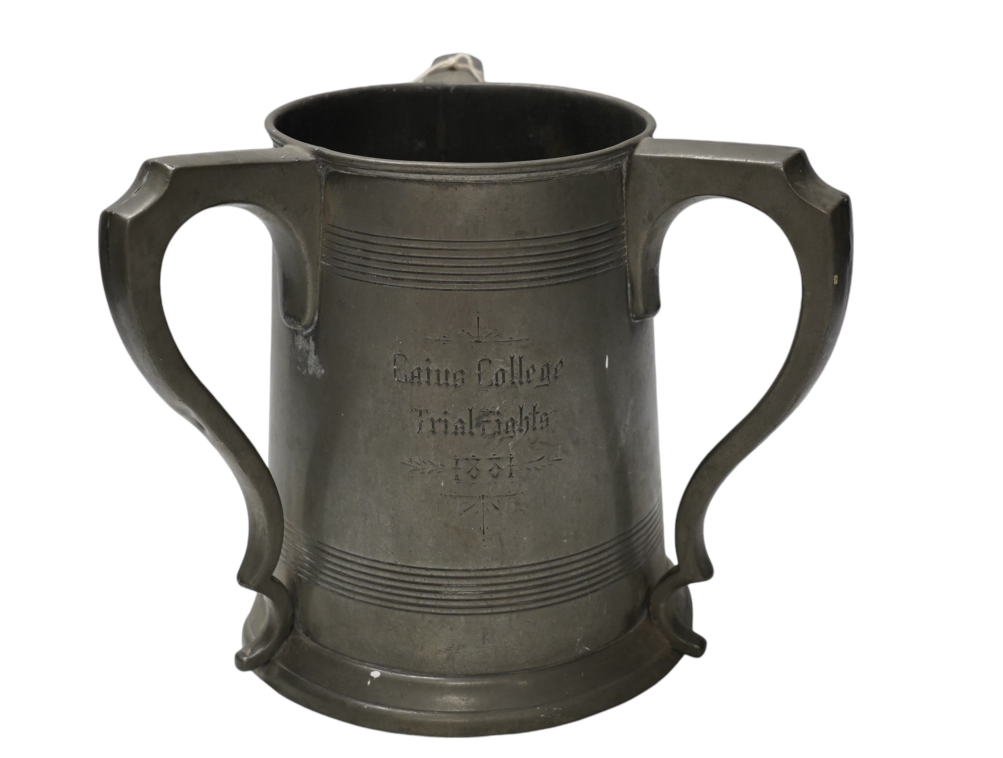 A 19th century pewter three handled rowing trophy from Caius College, 19cm. Condition - fair